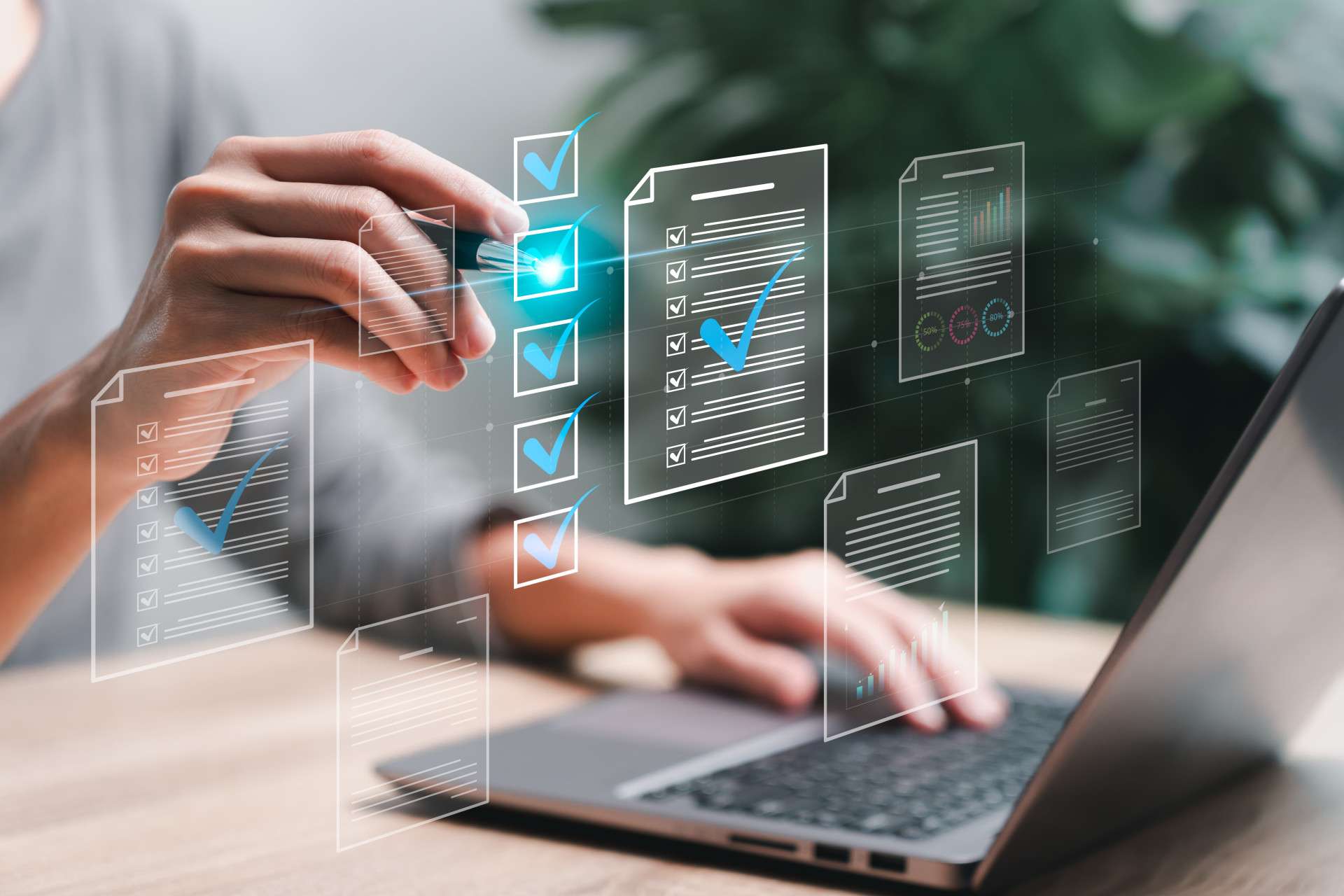  Person using a laptop and interacting with digital checklists and documents, symbolizing task completion, assessments, or compliance processes.