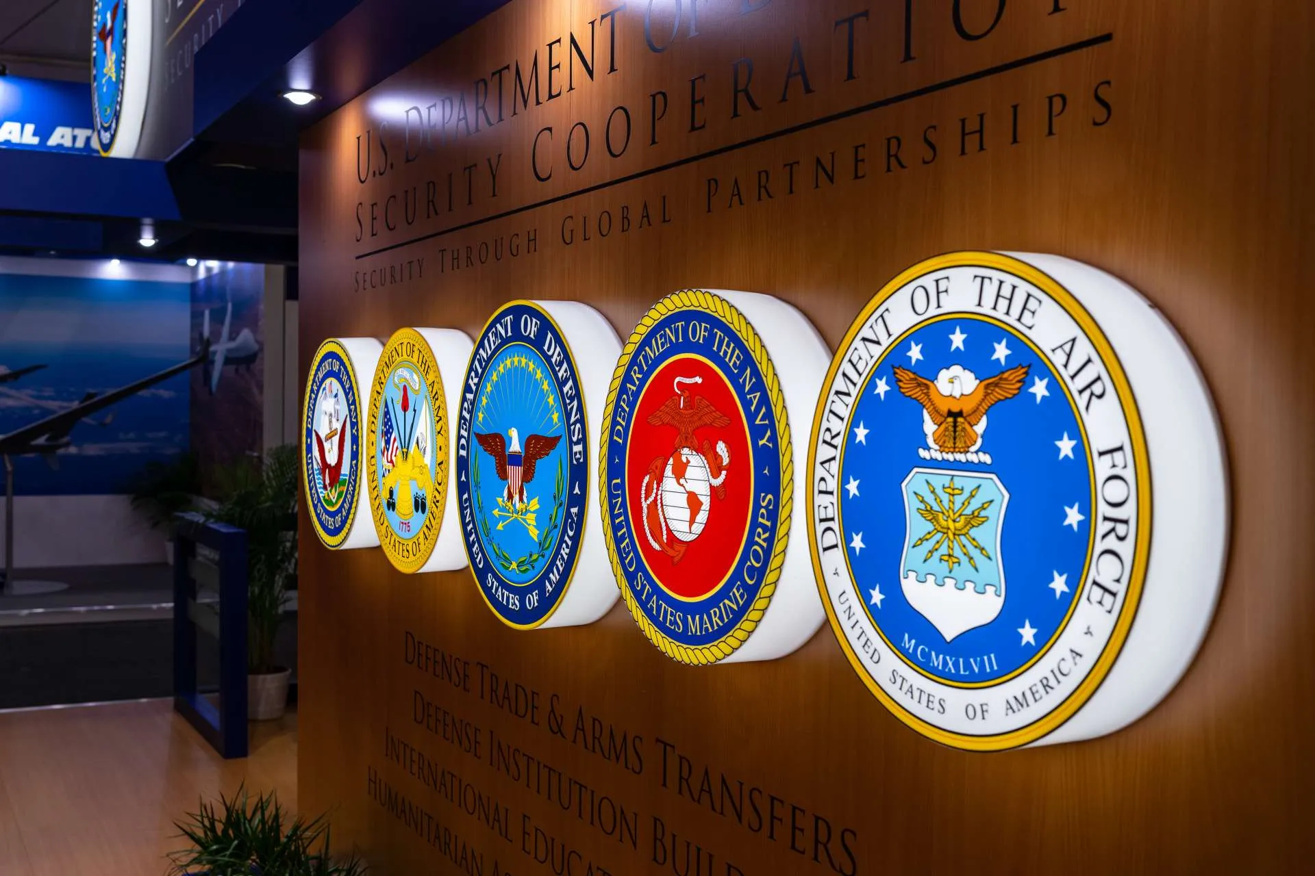 Image of department of defense logos mounted to a wall
